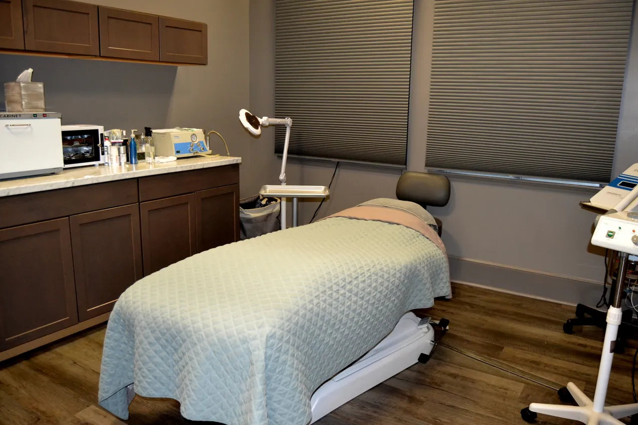 Private facial treatment room with magnifying lamp and heated bed in Lakewood Ranch